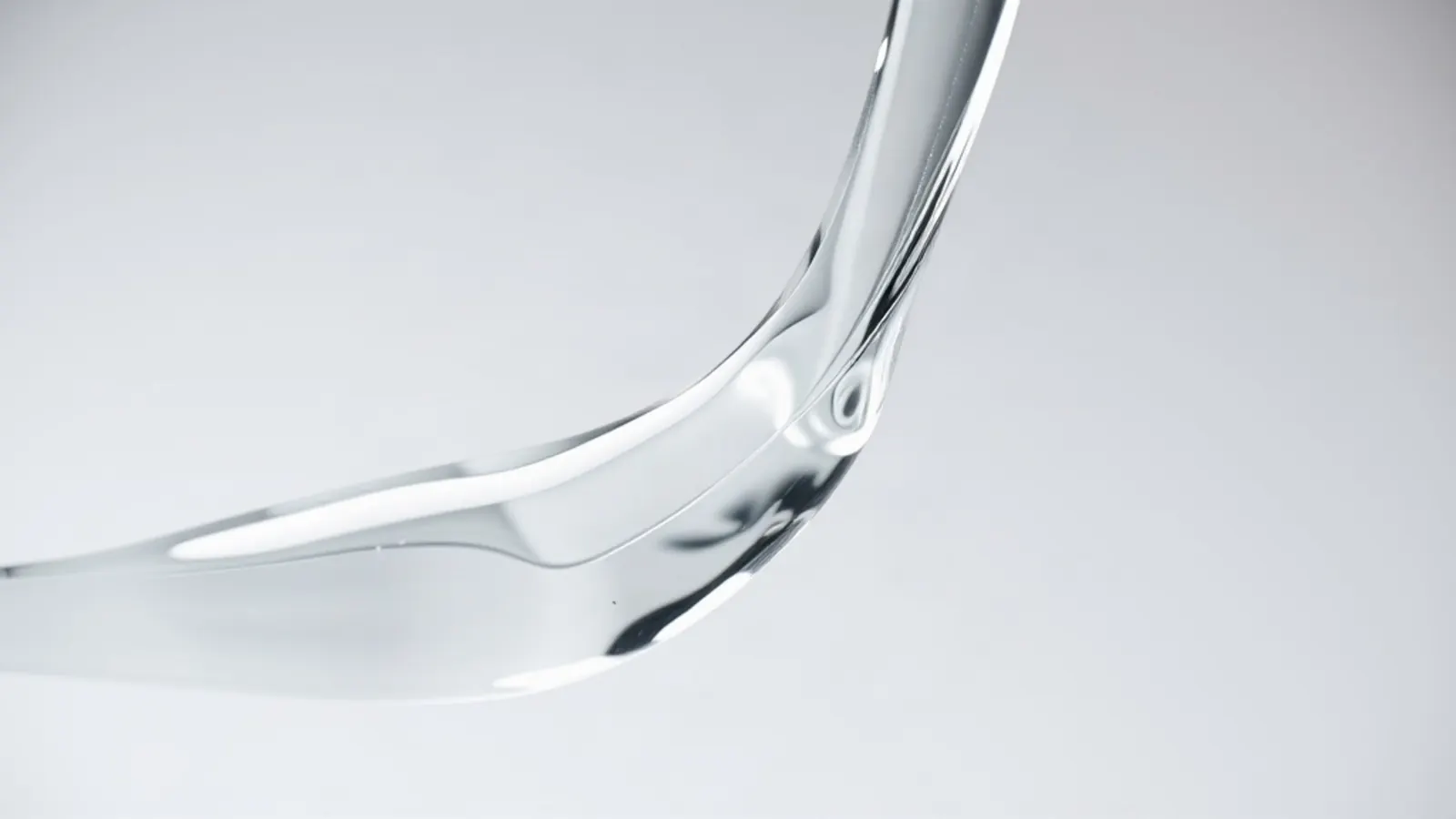Clear viscous gel pouring in a ribbon